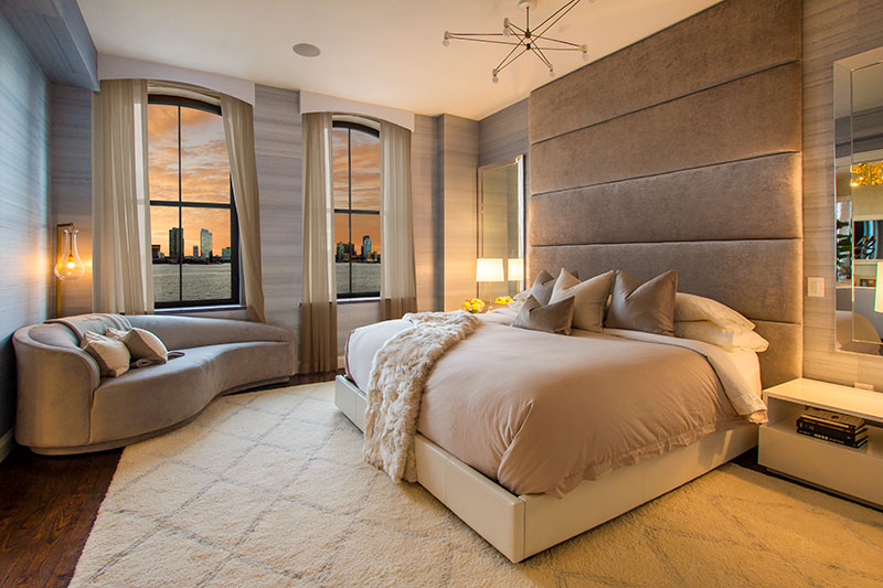 Residential interior overlooking the Hudson River at sunset